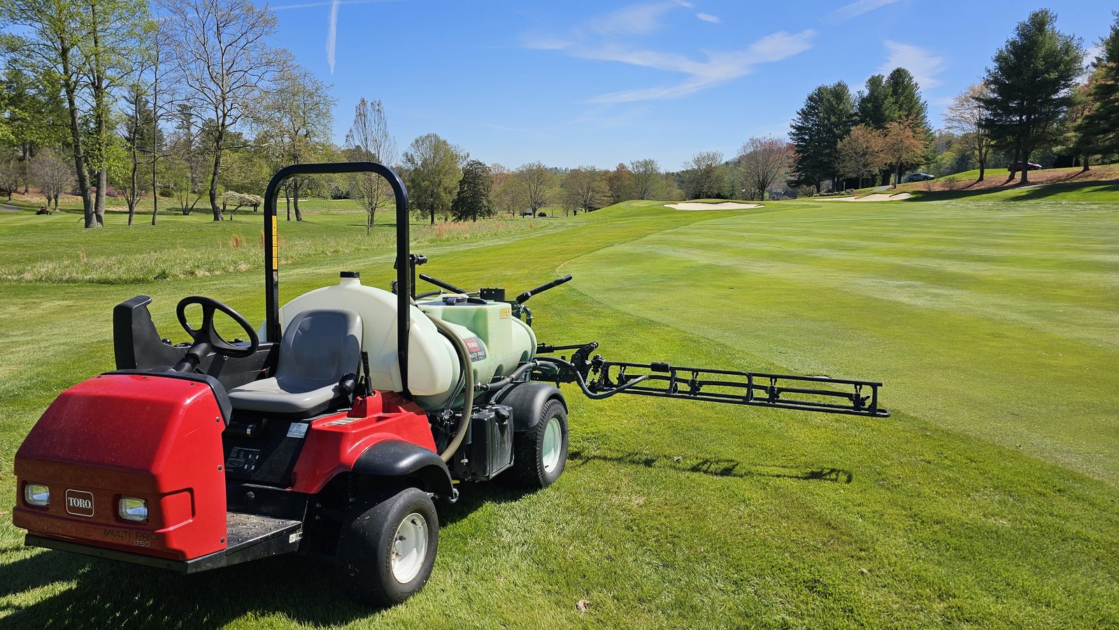 Golf course spray rig staged on turf